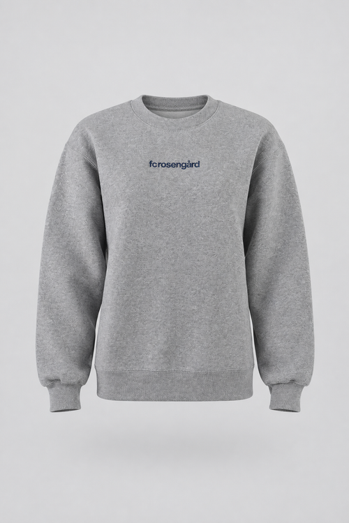 Commercial packshot of the grey FC Rosengård crewneck on a light gray seamless backdrop