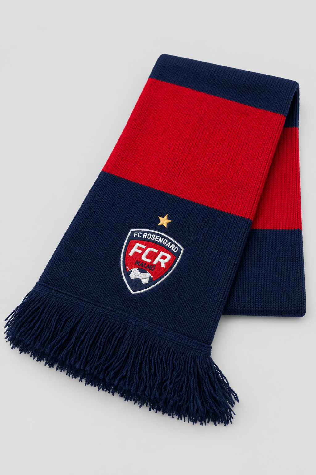 Studio product shot of the navy and red FC Rosengård scarf with crest and fringe